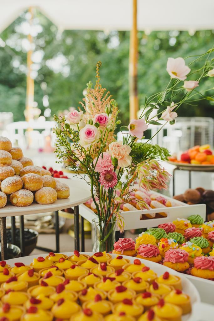 flowers in a vase on a buffet table